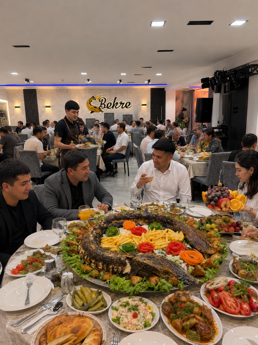 Groups sharing a sturgeon feast in the Bekre dining hall